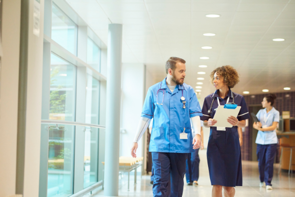 Case manager and doctor walking